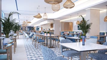 Un restaurante moderno con techos altos, iluminación colgante y una variedad de opciones de asientos, incluyendo mesas y cabinas.