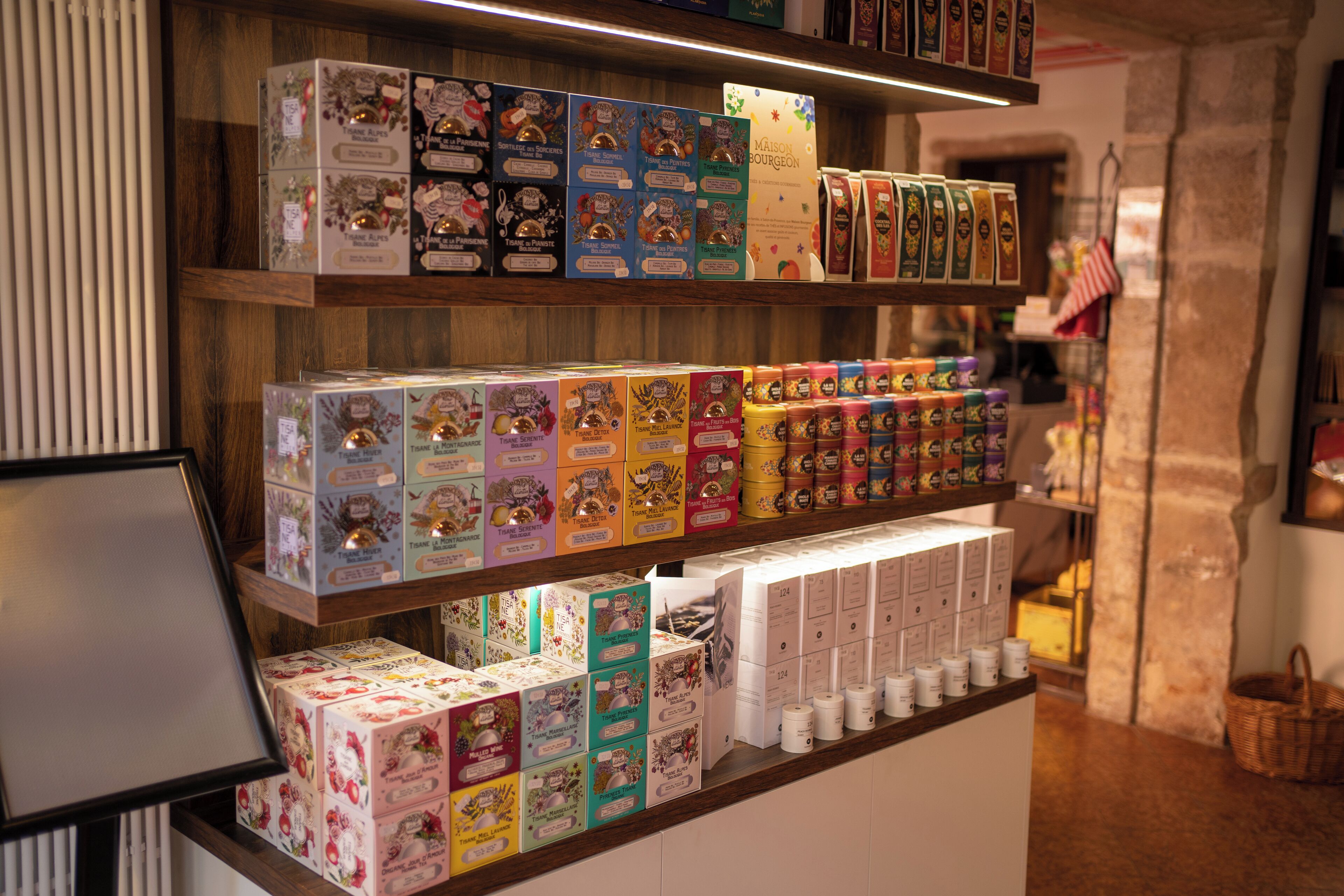 A display of various packaged goods on shelves in a store.