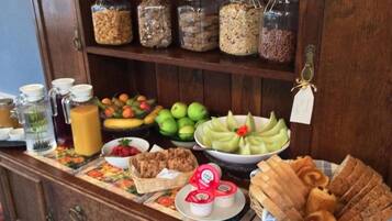A breakfast buffet with various food items and condiments.
