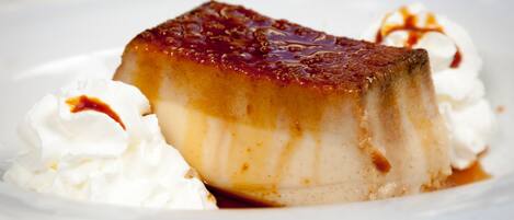 A dessert with caramel sauce and whipped cream.