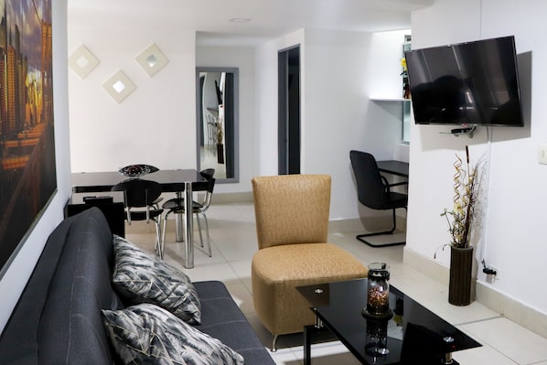 Family Apartment, 4 Bedrooms (Koral 101) | Living area | Flat-screen TV