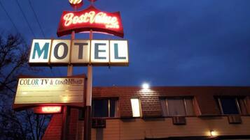 Experience the charm of Best Value motel, offering COLOR TV & CONDITIONED rooms in a two-story building.