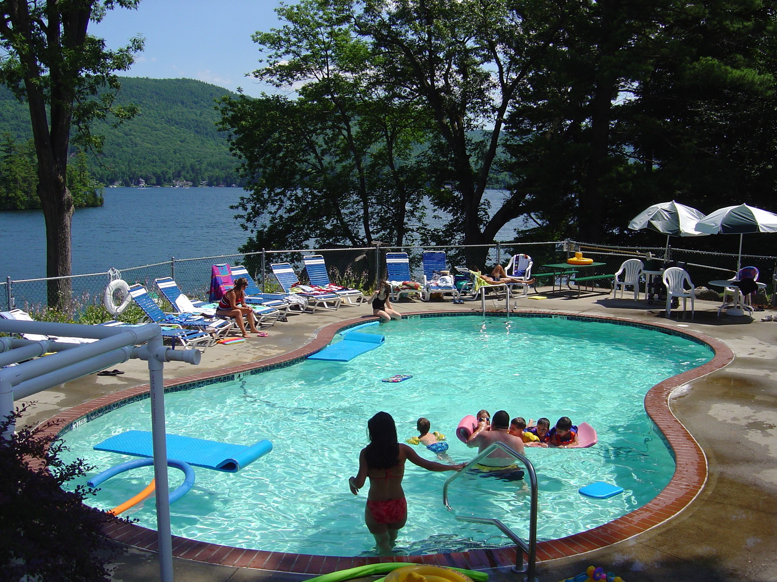 seasonal outdoor pool, pool umbrellas, pool loungers