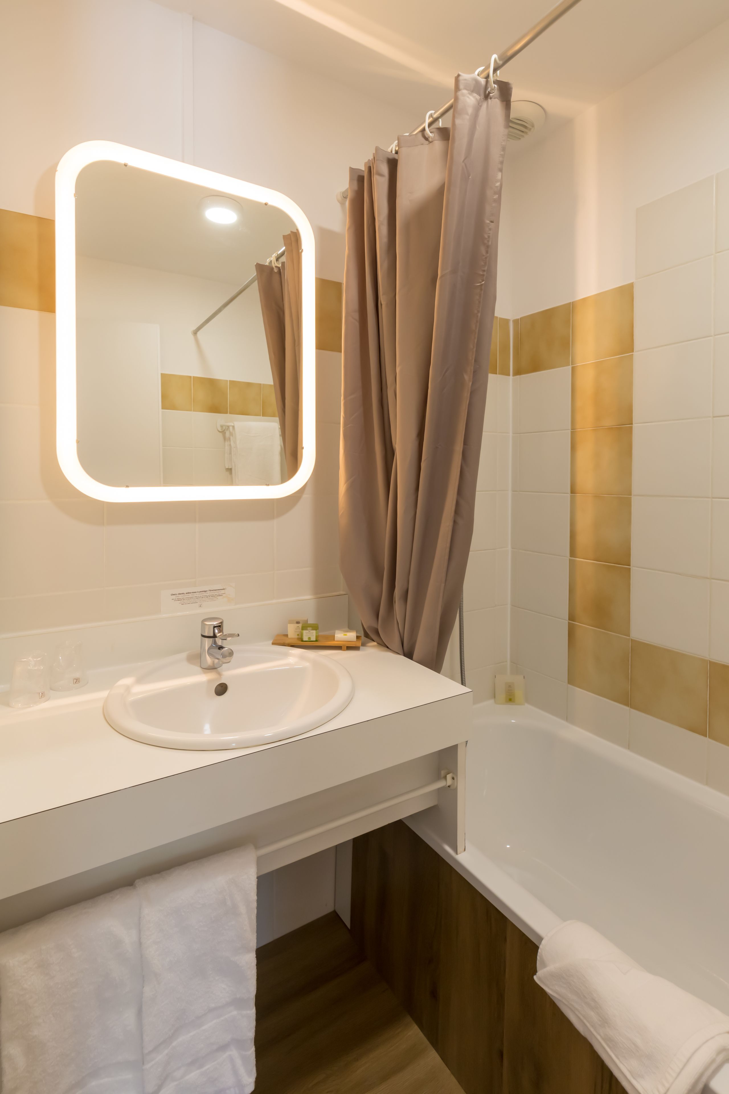 bathtub, free toiletries, hair dryer, towels