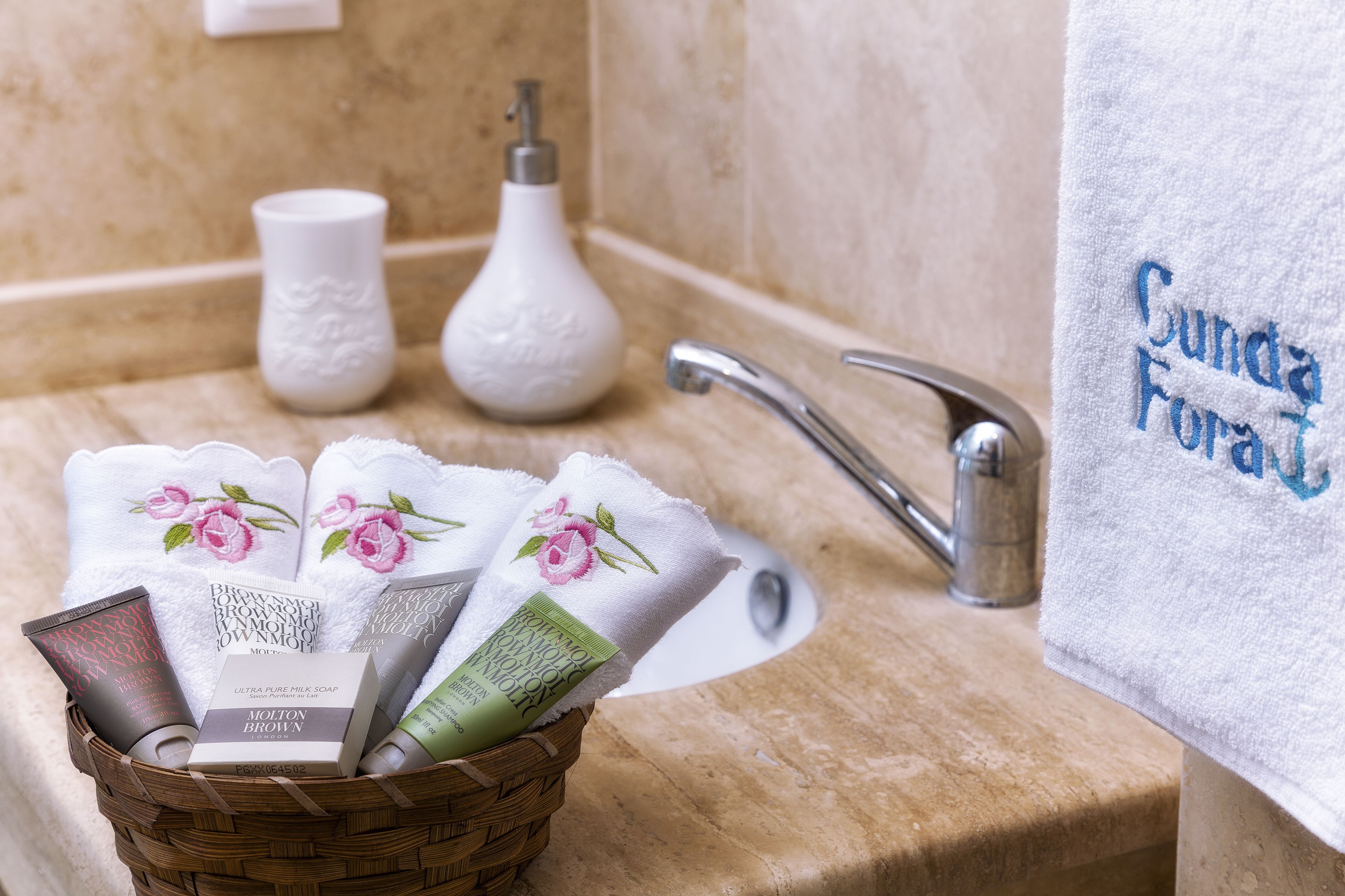 shower, designer toiletries, hair dryer, slippers