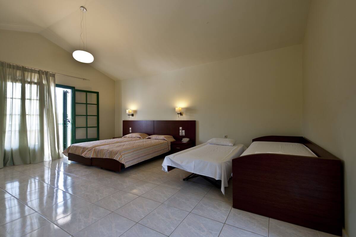 family room, sea view | in-room safe, desk, soundproofing, iron/ironing board