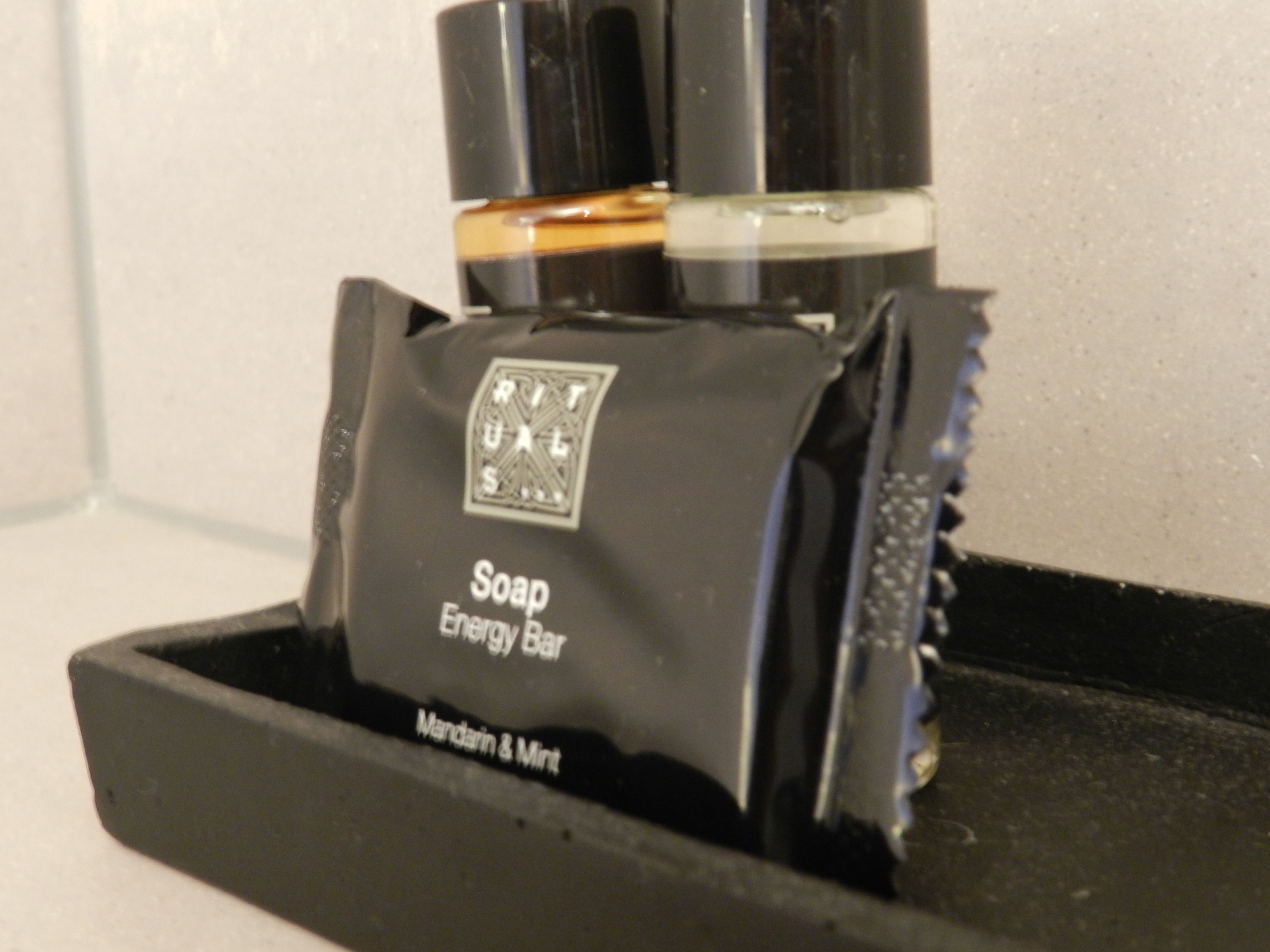 designer toiletries, hair dryer, towels