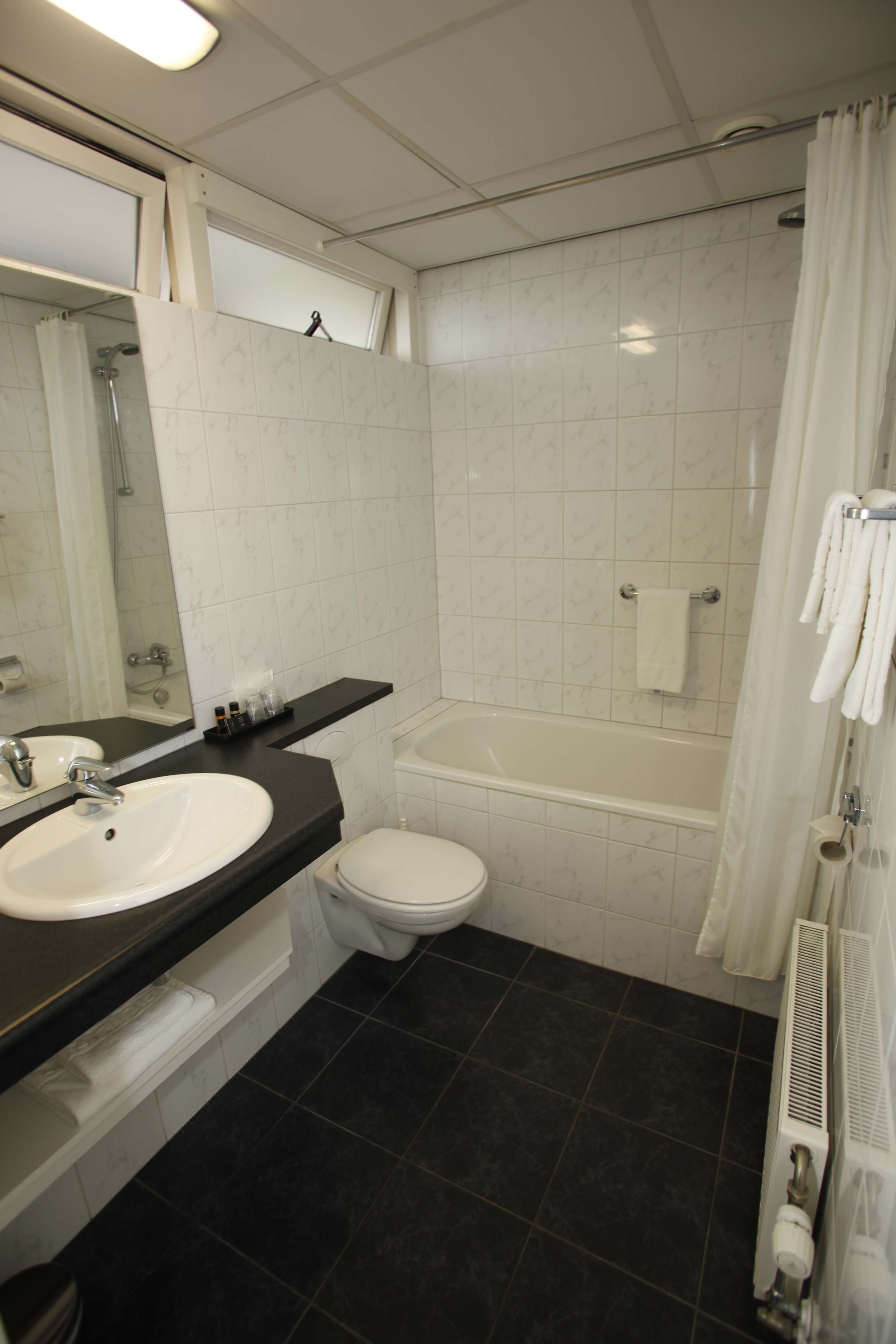 standard room | bathroom | designer toiletries, hair dryer, towels