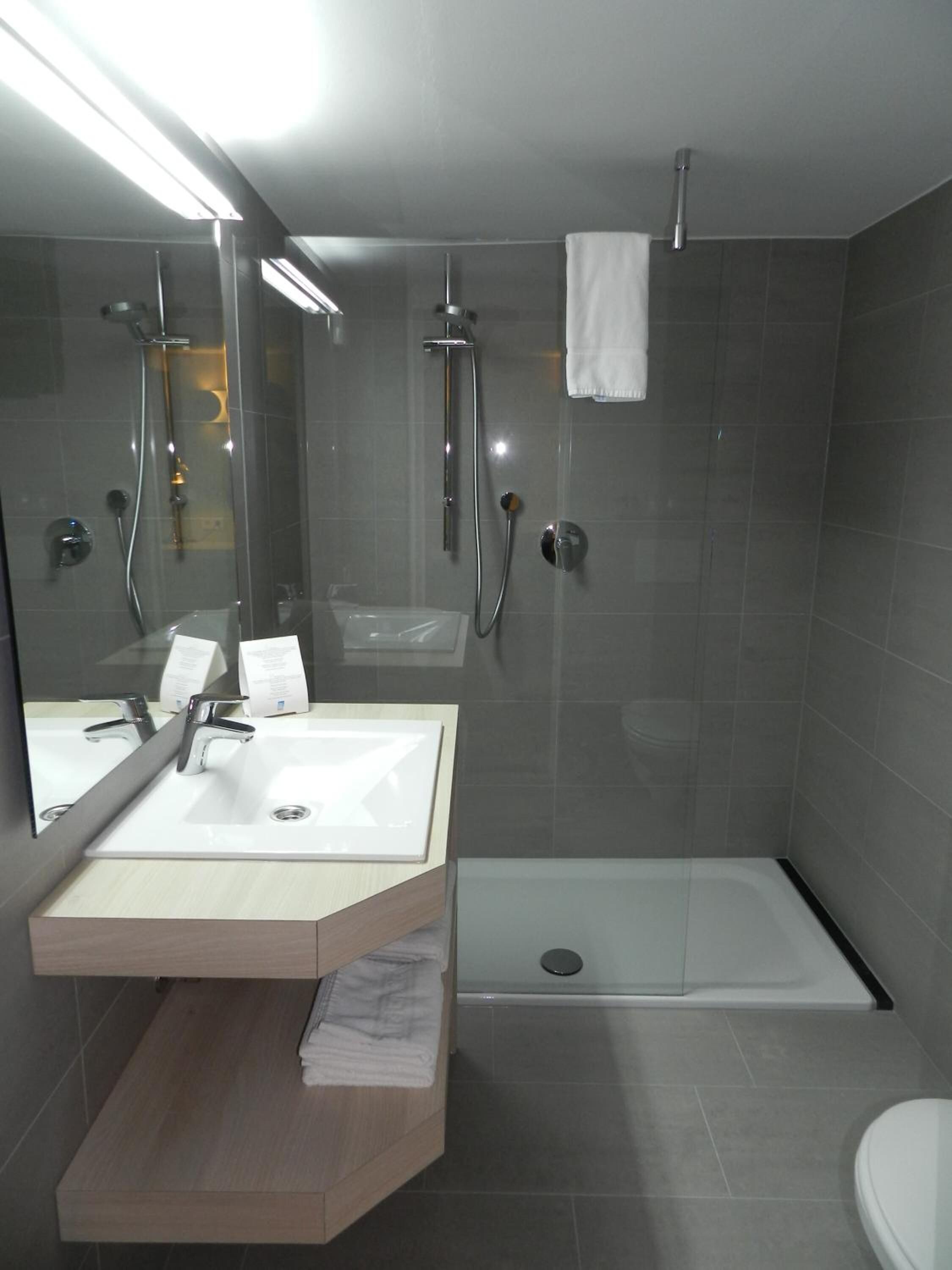 designer toiletries, hair dryer, towels