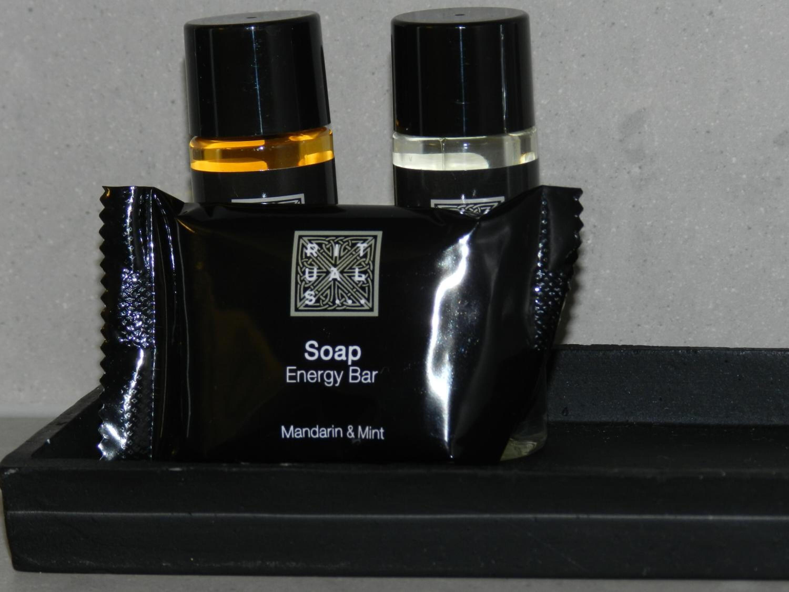 designer toiletries, hair dryer, towels