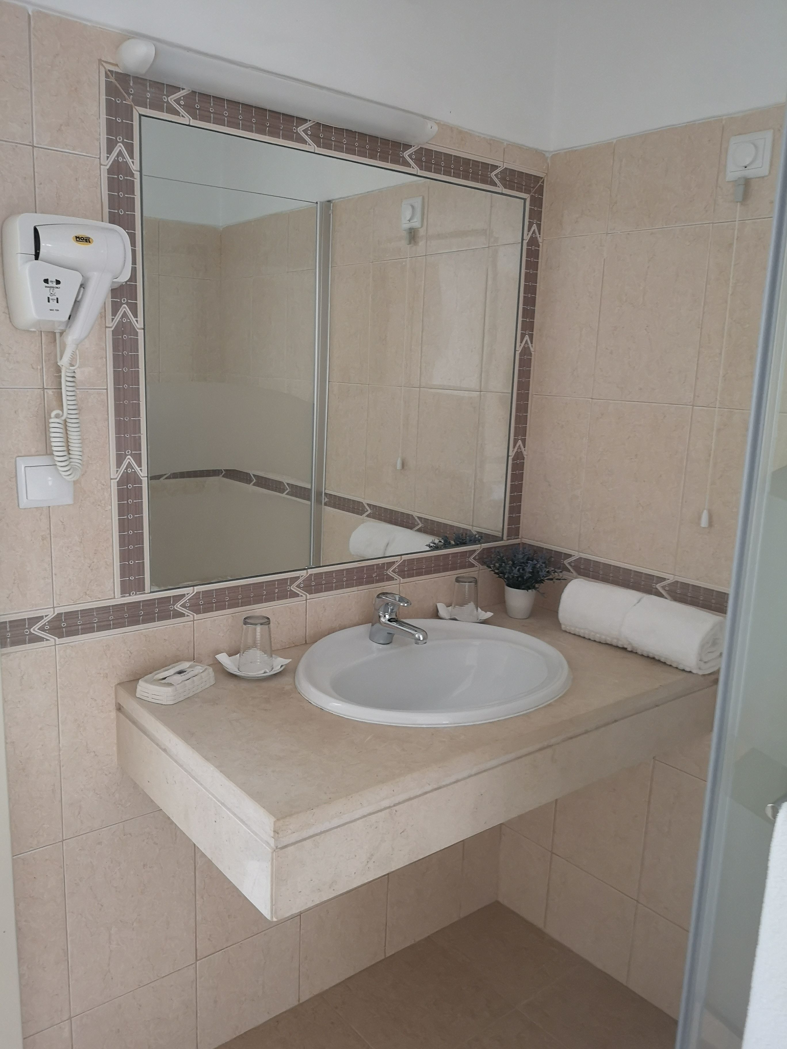 economy double room | bathroom | shower, rainfall showerhead, hair dryer, towels