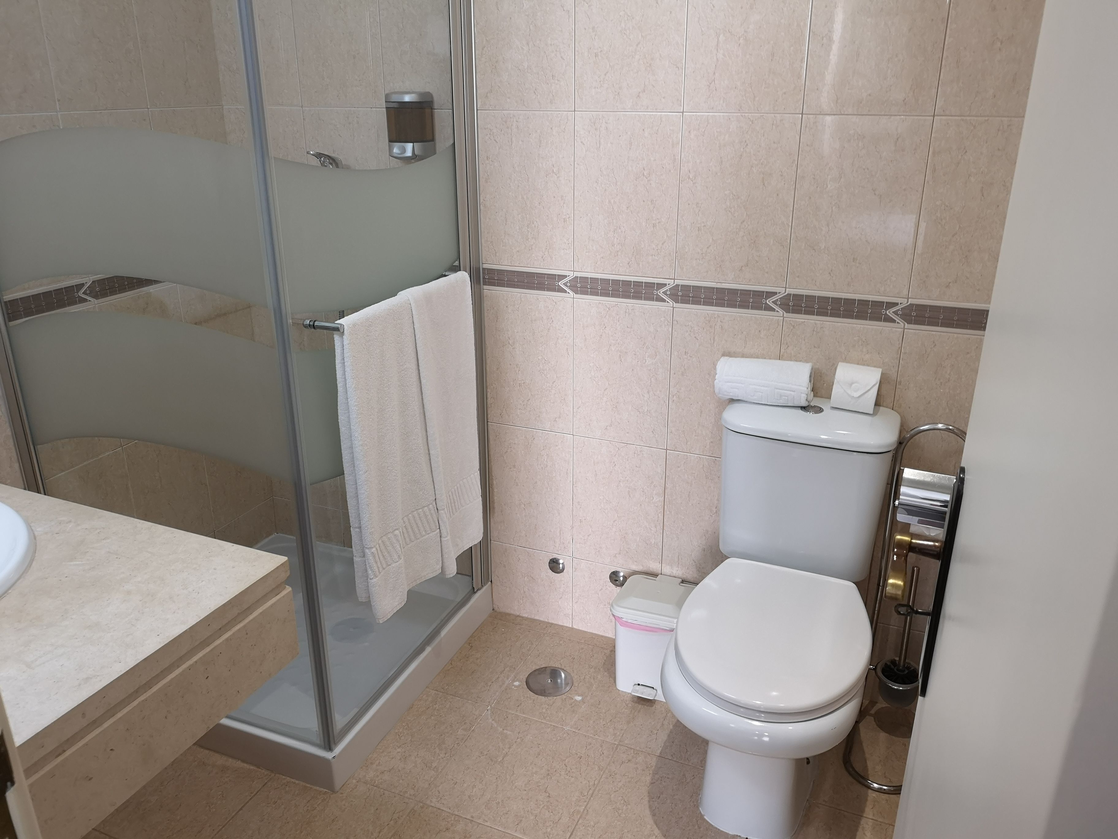 economy double room | bathroom | shower, rainfall showerhead, hair dryer, towels