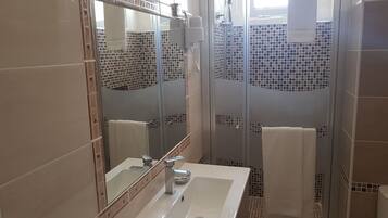 Shower, rainfall showerhead, hair dryer, towels