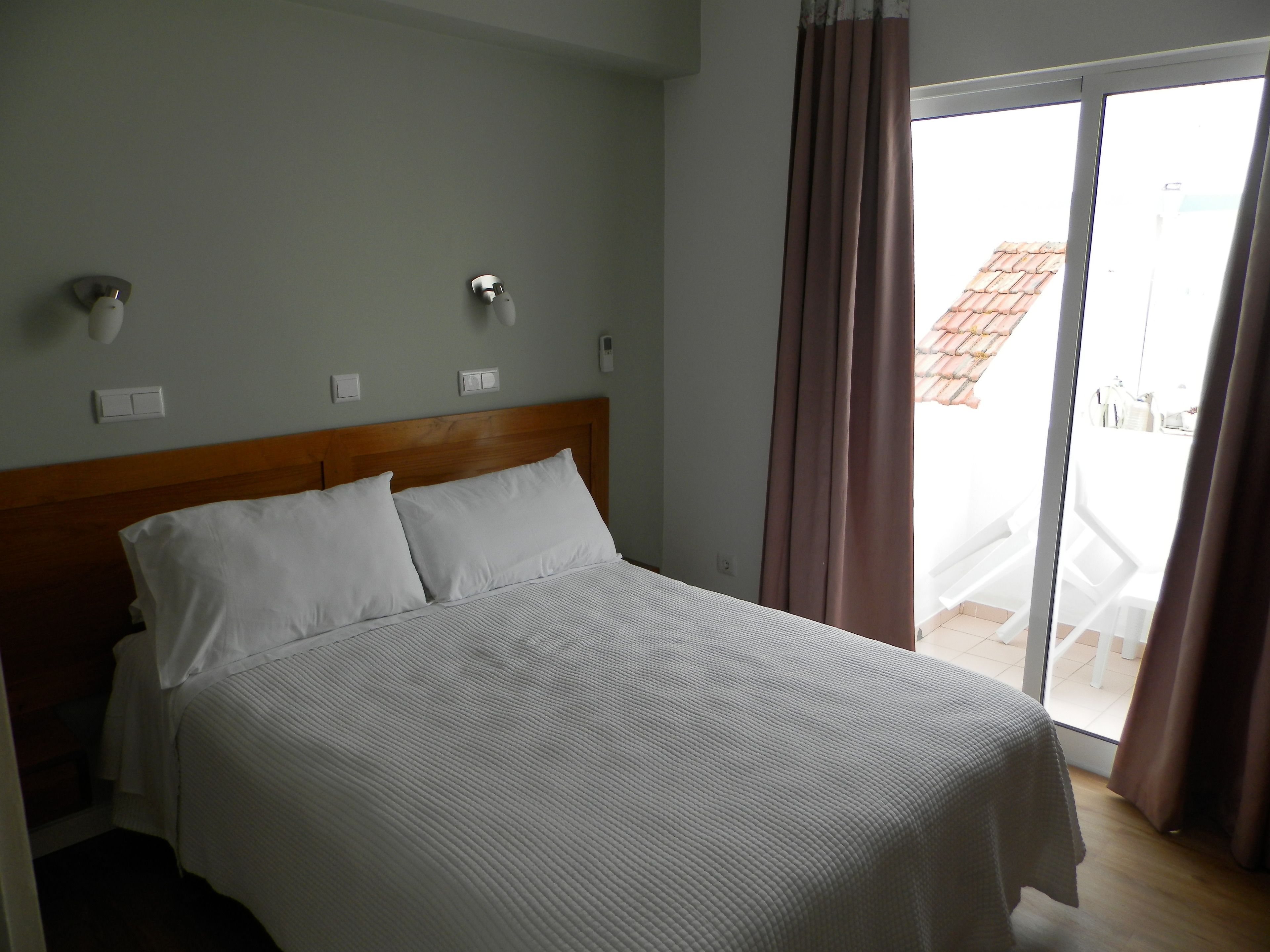 double room, balcony, partial sea view | in-room safe, desk, blackout curtains, iron/ironing board