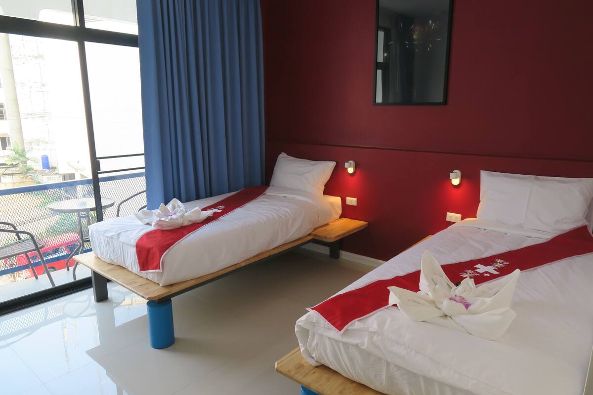 Twin Room with Balcony | Minibar, in-room safe, desk, blackout drapes