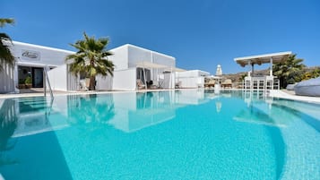 Seasonal outdoor pool, pool umbrellas, pool loungers