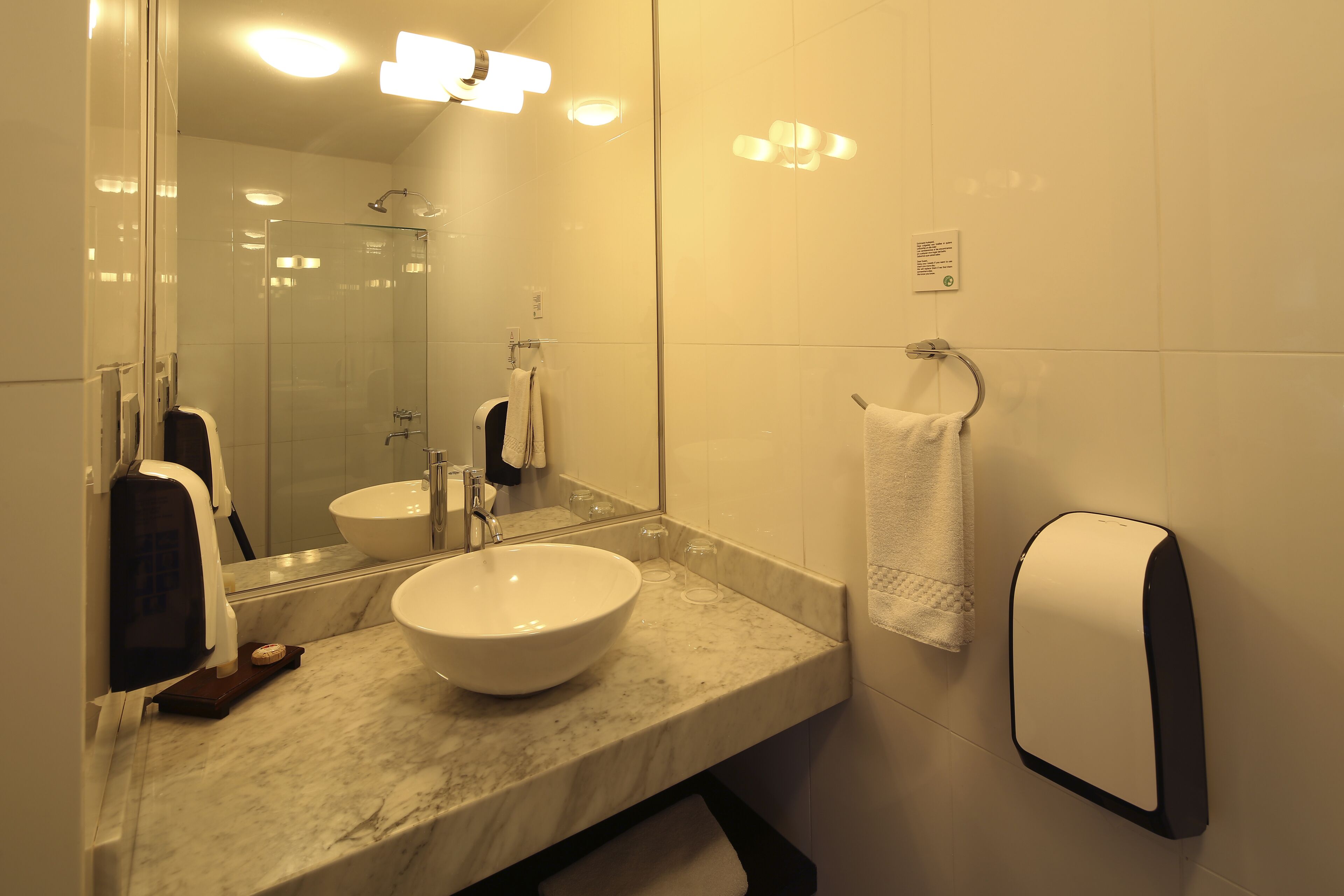junior suite | bathroom | shower, free toiletries, hair dryer, towels