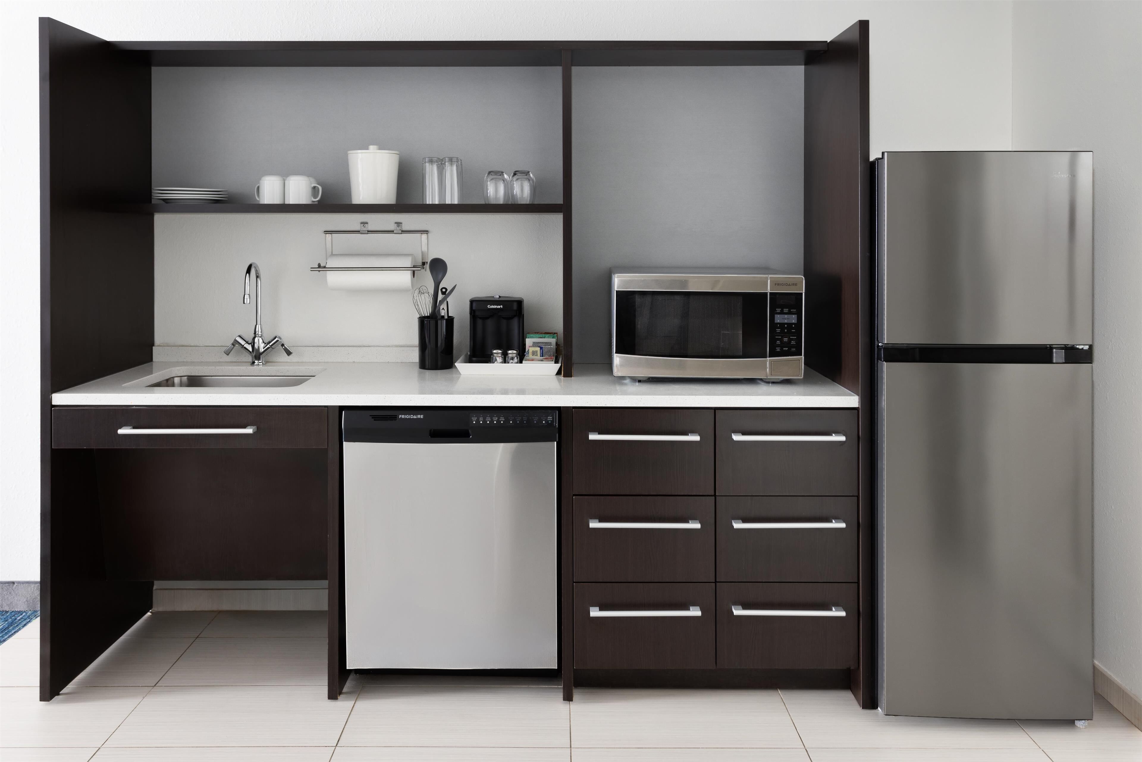 full-sized fridge, microwave, dishwasher, cookware/dishes/utensils