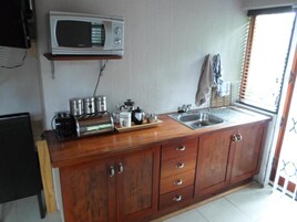 Luxury Apartment | Private kitchen | Full-size fridge, microwave, oven, stovetop