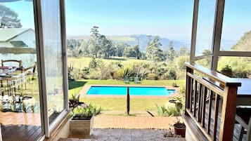 Outdoor pool, open 6 AM to 7 PM, pool loungers