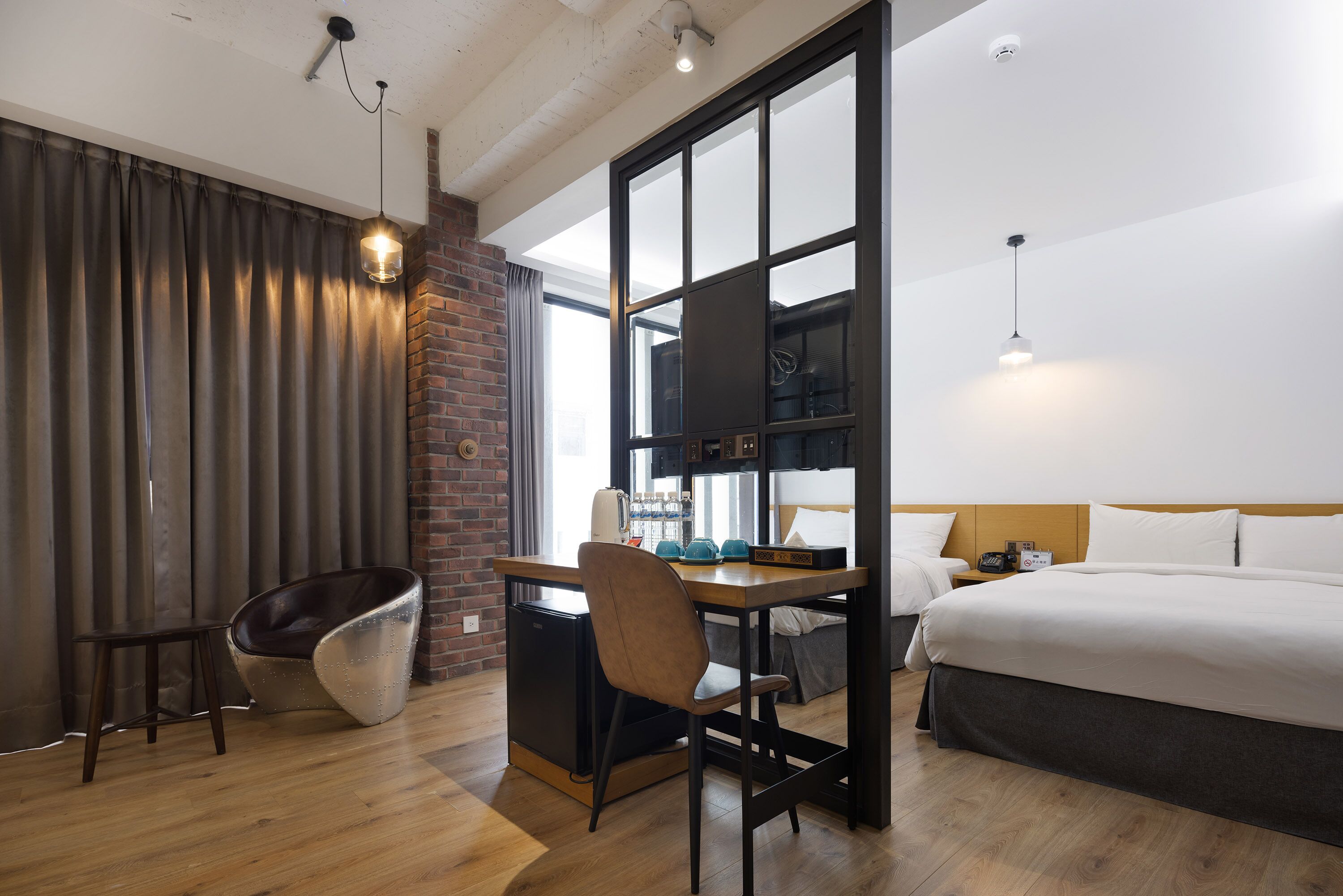 deluxe quadruple room | down duvets, minibar, desk, laptop workspace