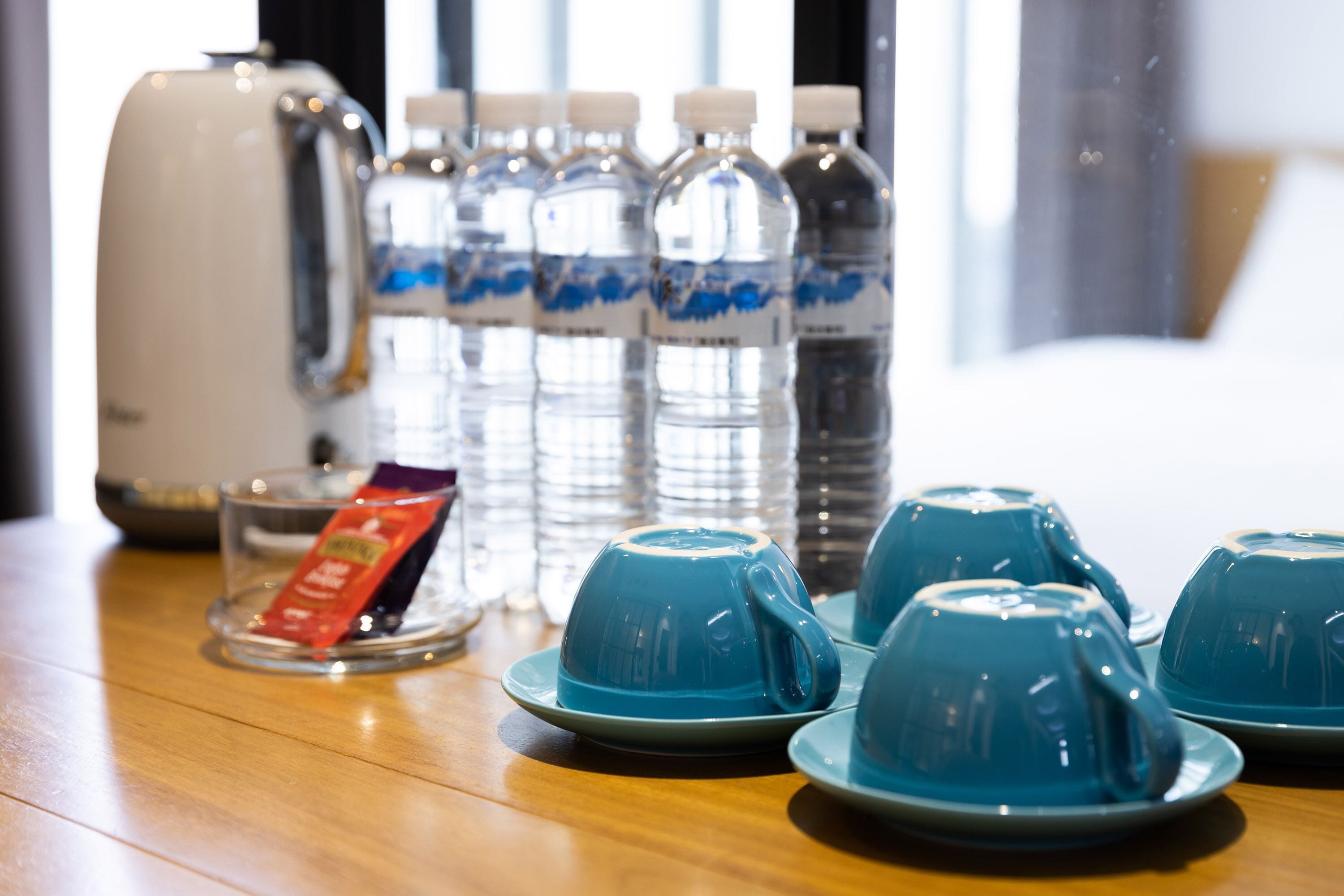 deluxe quadruple room | down duvets, minibar, desk, laptop workspace