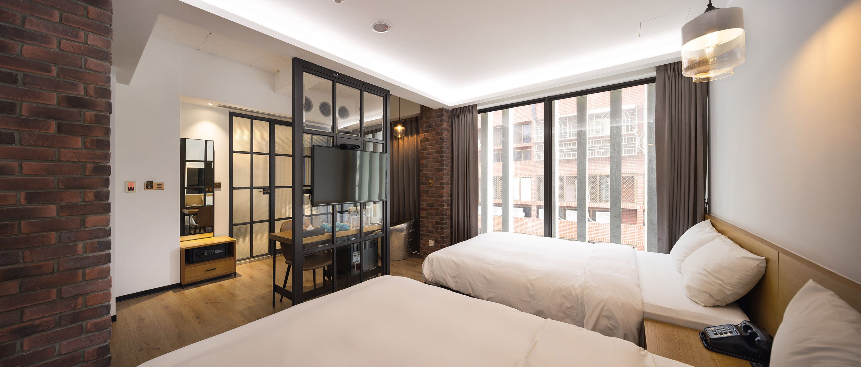 deluxe quadruple room | down duvets, minibar, desk, laptop workspace