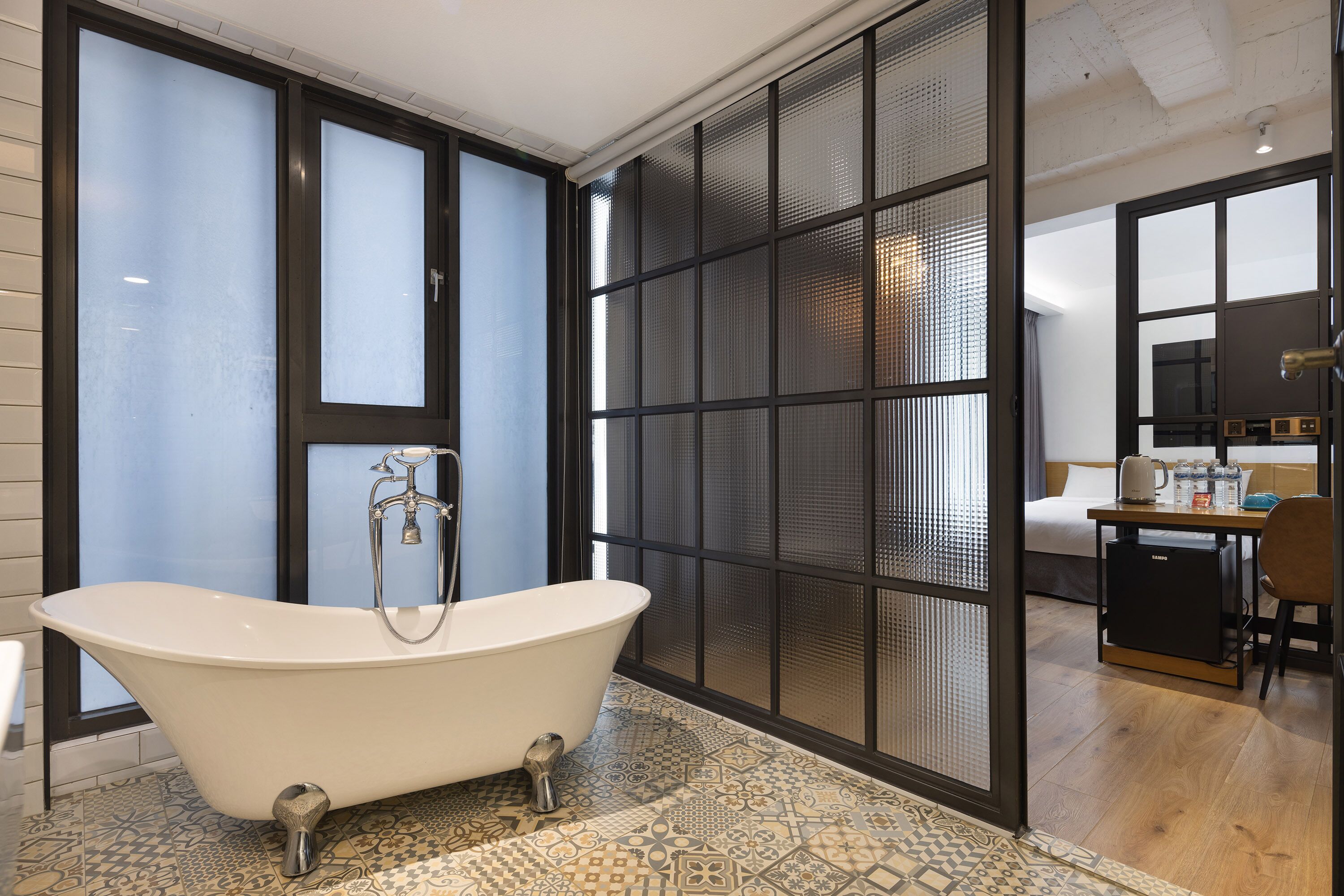 deluxe quadruple room | bathroom | hair dryer, slippers, towels, soap