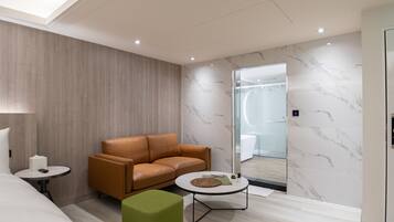 Classic Quadruple Room | Living area | LCD TV