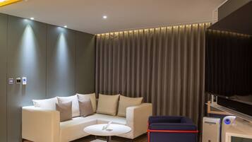 Deluxe Double Room | Living area | LCD TV