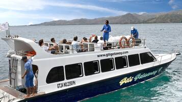 A boat with a website URL, GT.2340PD, and a logo on its side.