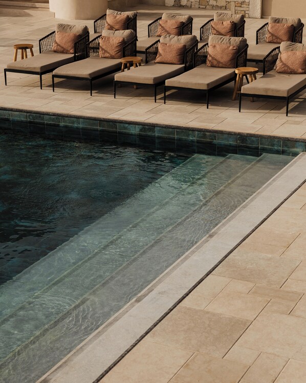 2 outdoor pools, open 9:00 AM to 7:00 PM, pool umbrellas, pool loungers