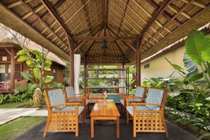 Superior Bungalow | Living area | 45-cm LED TV with satellite channels, TV, DVD player
