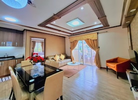 2-Bedroom Apartment at Bonbel Condominium | Living area | 36-inch flat-screen TV with cable channels, TV, table tennis