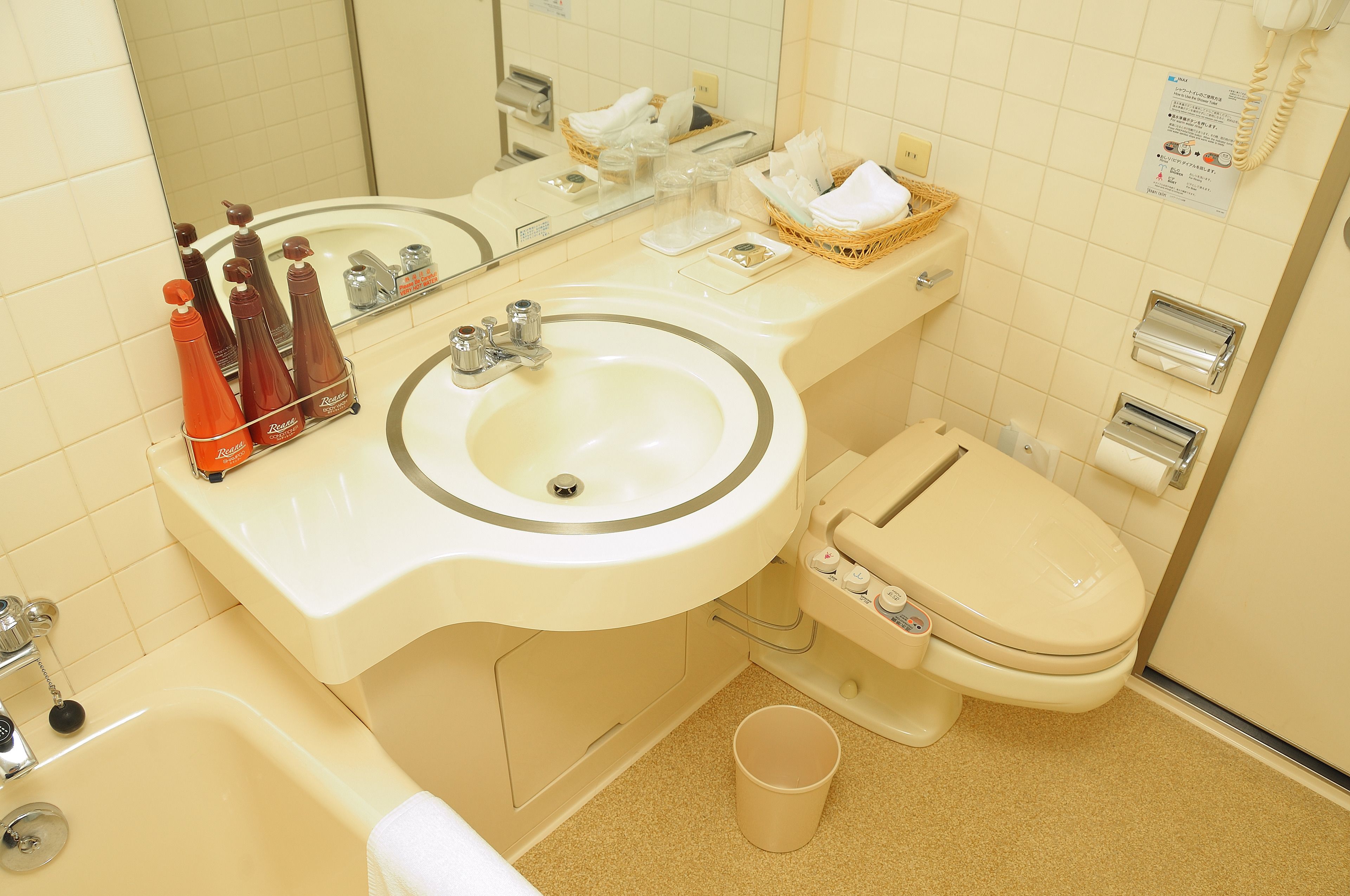 combined shower/bathtub, free toiletries, hair dryer, slippers