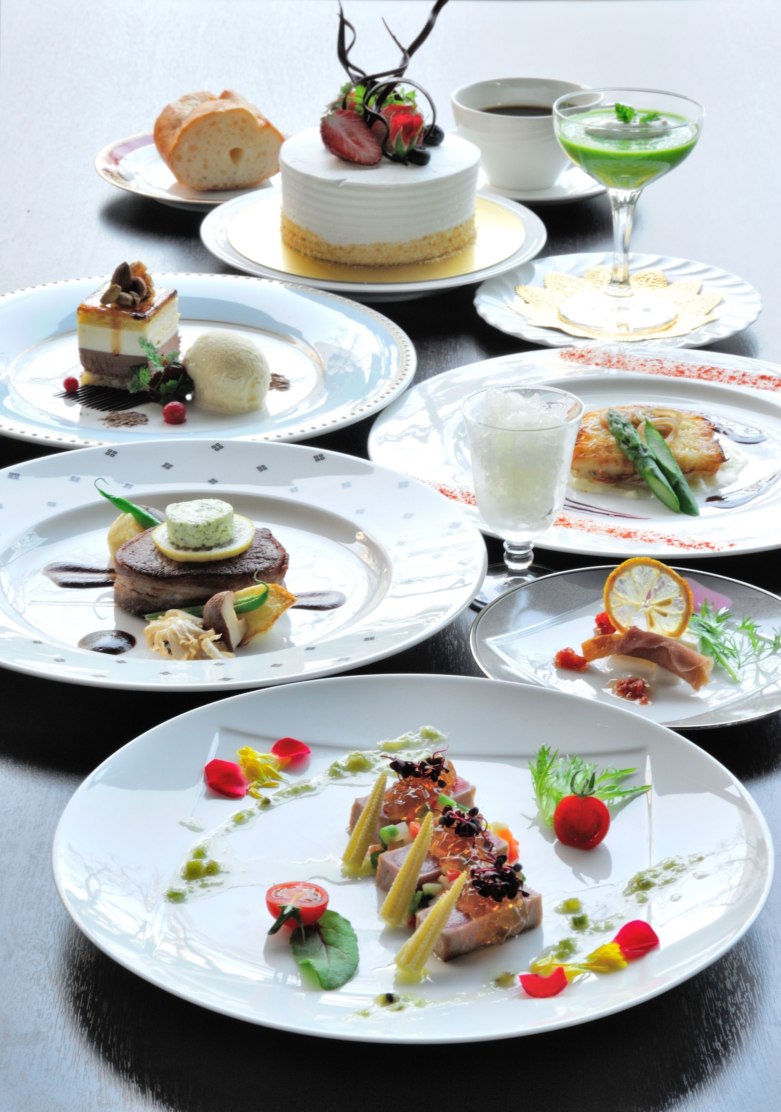 A variety of plated dishes with different food presentations.