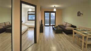 A modern apartment with a living area, a bedroom, and a balcony. - Baltic Sol (Wladyslawowo)