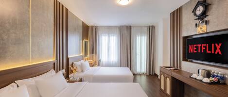 Family Room | Minibar, blackout drapes, iron/ironing board, free WiFi