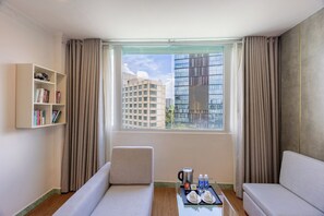 Deluxe Suite Room | Minibar, blackout drapes, iron/ironing board, free WiFi