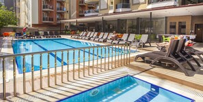 Outdoor pool, pool umbrellas, pool loungers
