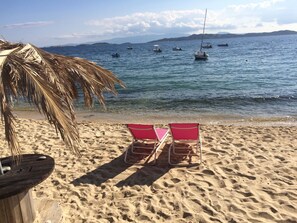 On the beach, sun loungers, beach umbrellas, beach towels