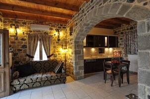 Villa, 2 Bedrooms, Sea View (Kalysto) | Living area | 22-inch flat-screen TV with satellite channels, TV, fireplace