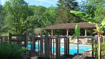 Seasonal outdoor pool, a waterfall pool, pool umbrellas, pool loungers