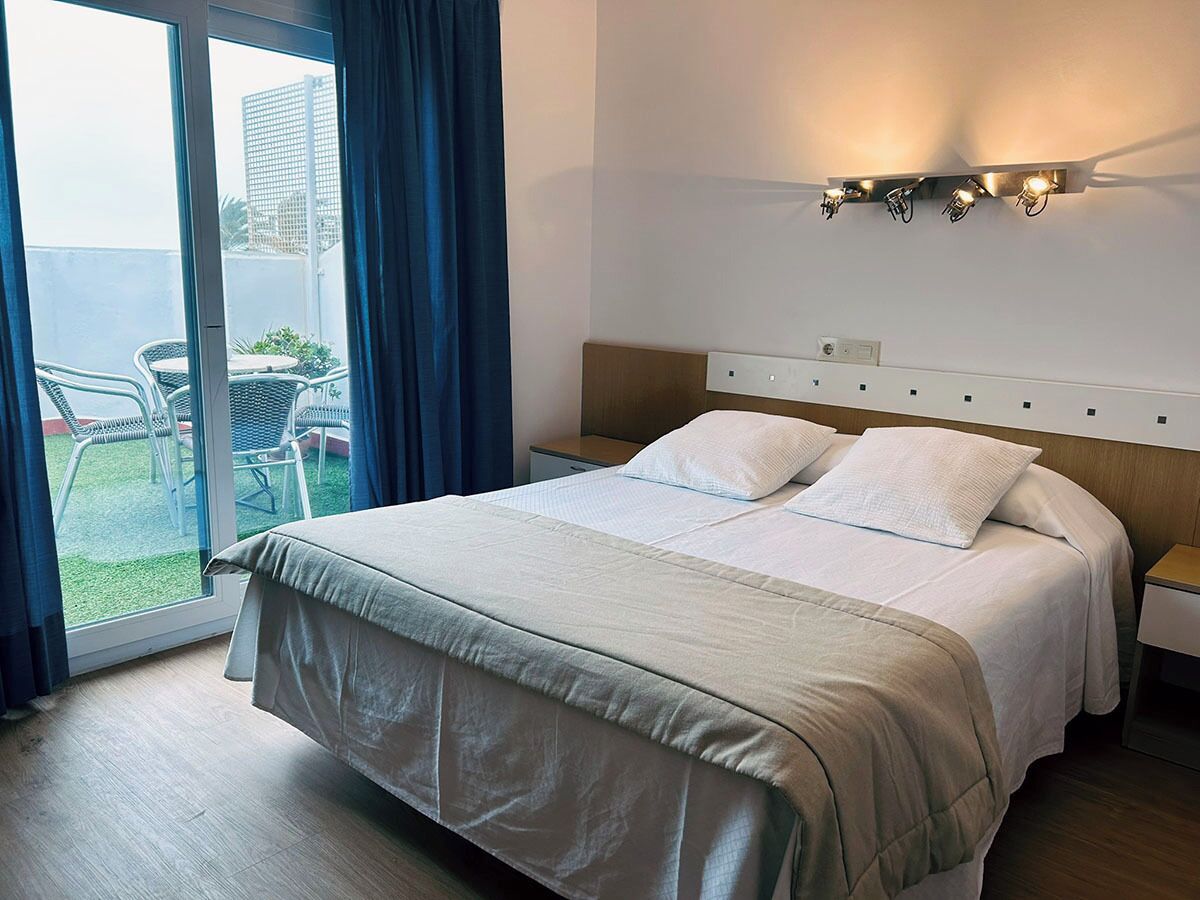 Deluxe Quadruple Room | In-room safe, desk, laptop workspace, blackout drapes