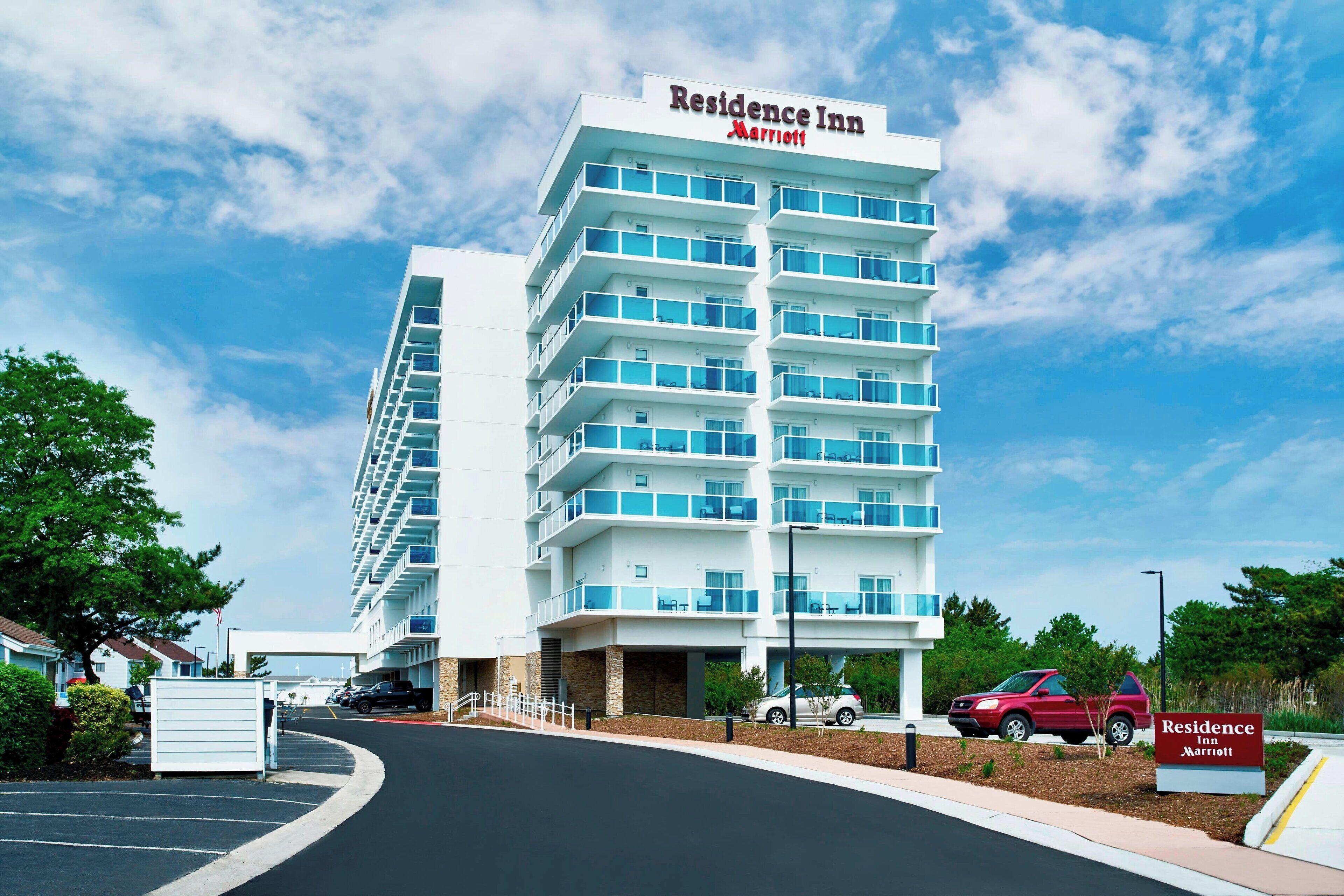 A multi-story hotel with a prominent sign reading "Residence Inn Marriott."
