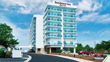 A multi-story hotel with a prominent sign reading "Residence Inn Marriott."
