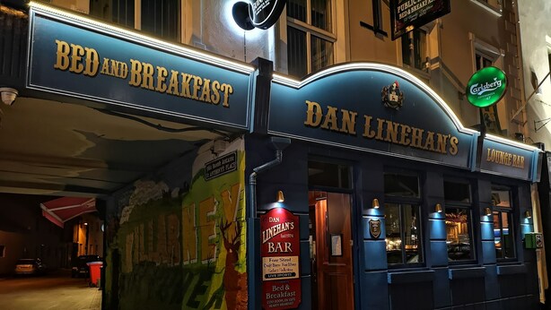 A building with a sign reading "Dan Linehan's Bar" and "Bed and Breakfast". - Dan Linehans Bar and B&B (Killarney)