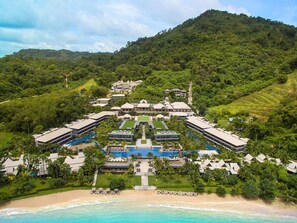 A resort with a central pool, beachfront, and lush greenery. - Phuket Marriott Resort and Spa, Nai Yang Beach (Sa Khu)