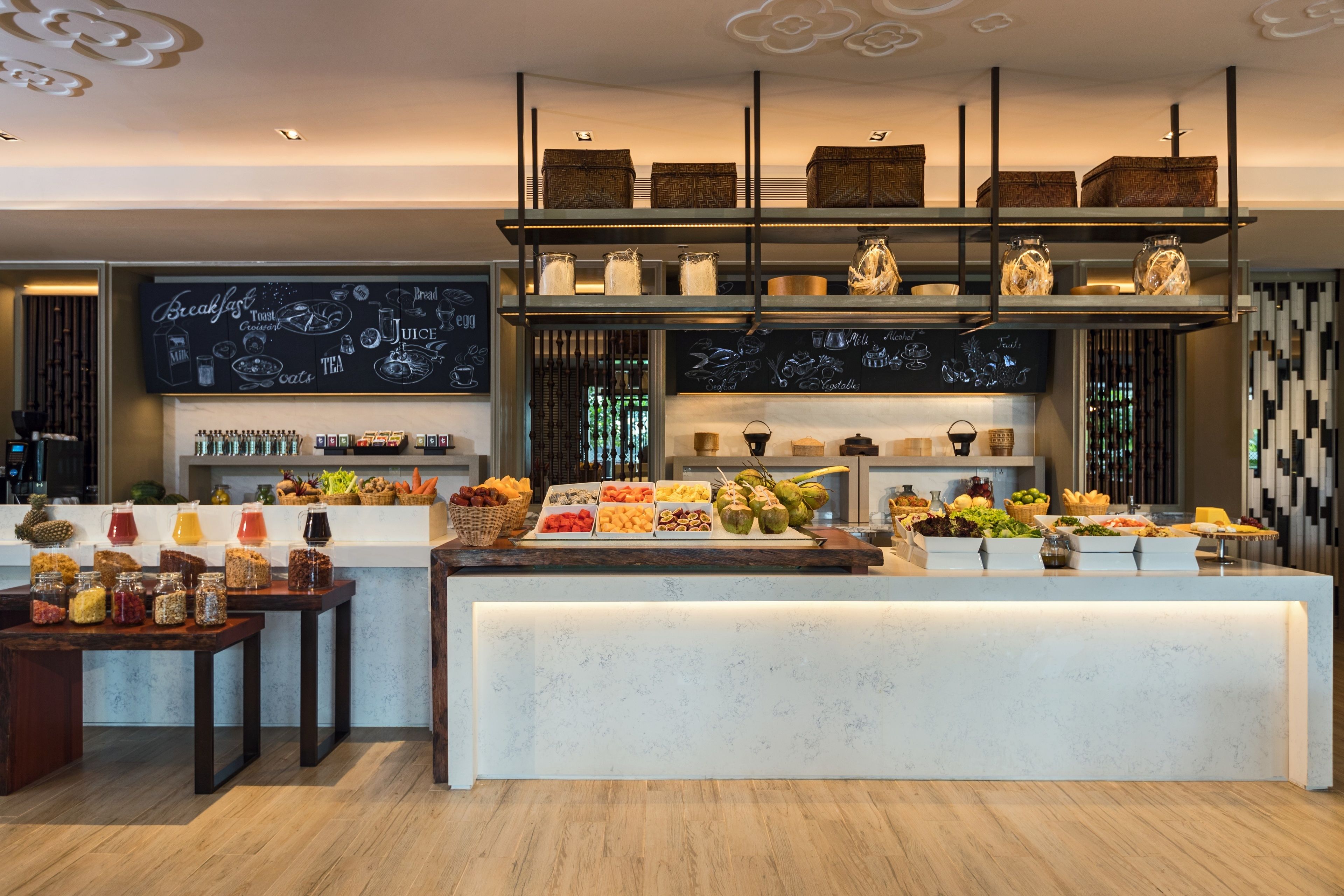 A breakfast buffet with various food items and beverages.
