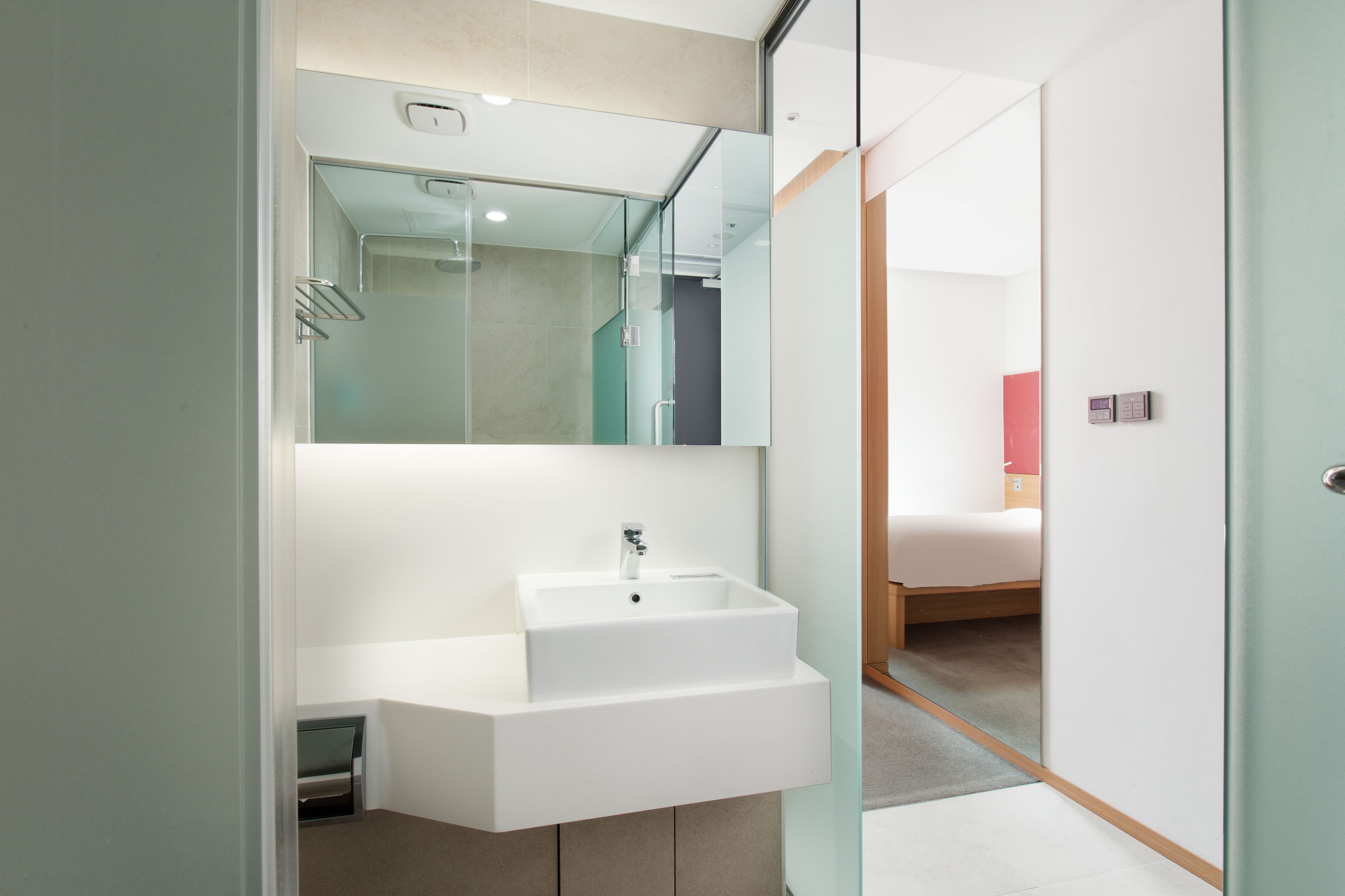 shower, hair dryer, slippers, towels